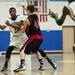 Huron sophomore Brian Walker passes while defended by a Pickney player on Monday, March 4. Daniel Brenner I AnnArbor.com